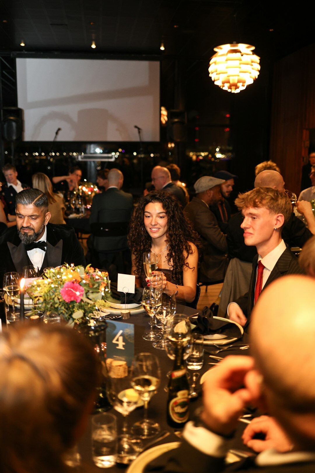Elegant gala event with photographers and well-dressed guests