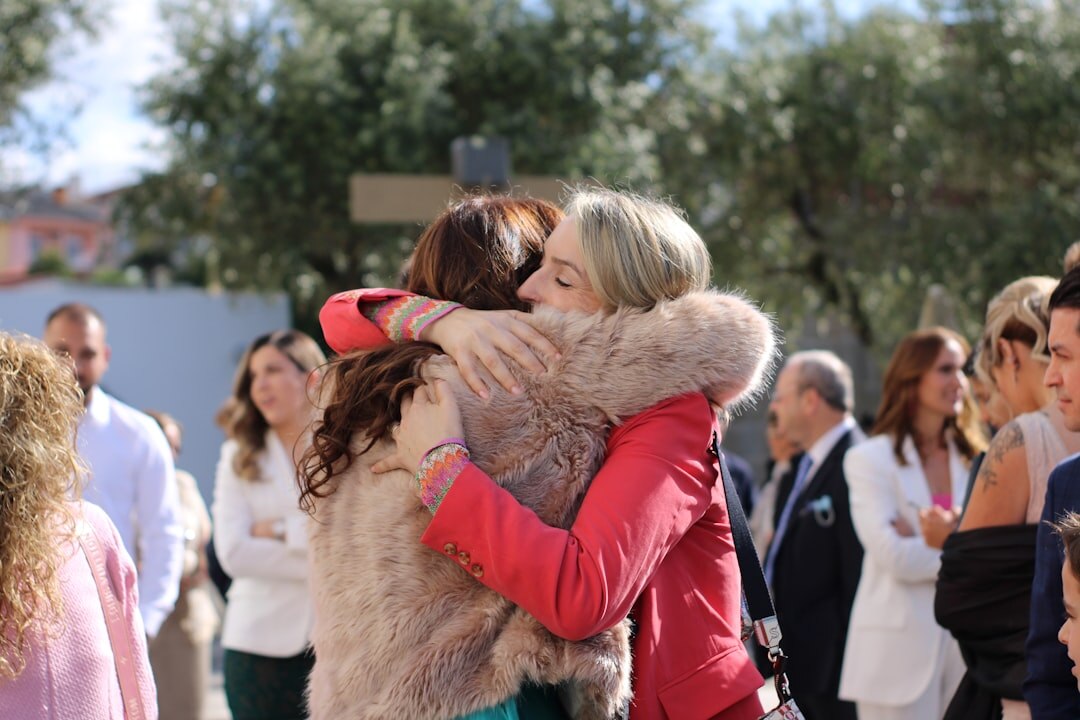 celebrity friends hugging after scandal